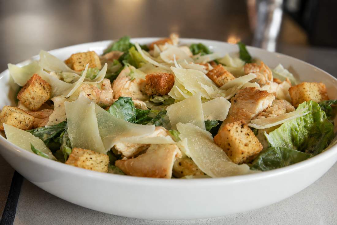 Chicken Caesar salad with shaved parmesan and croutons